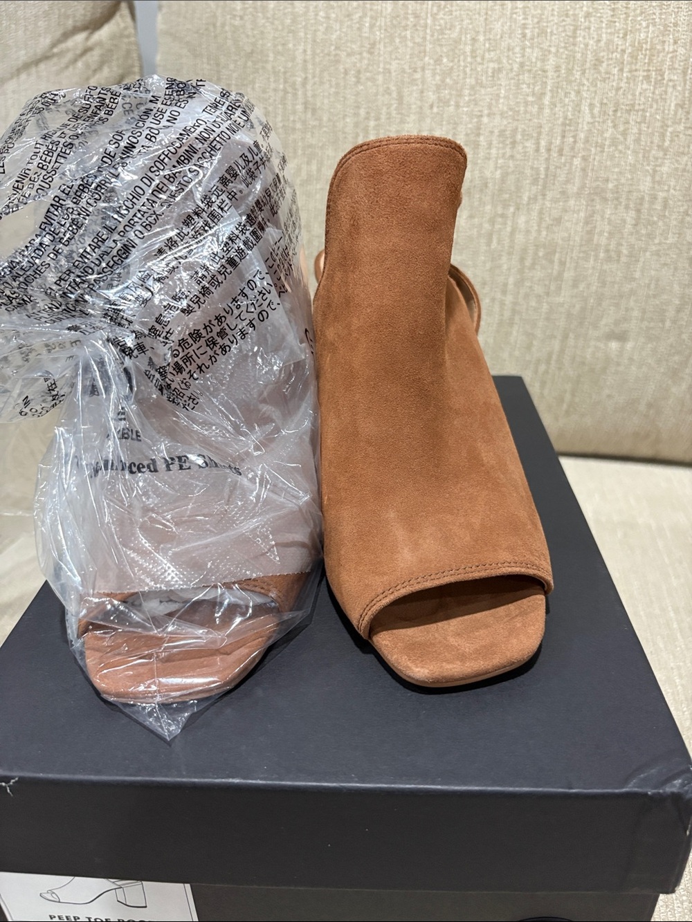 Banana republic Peep toe booties.
Brand new never worn in their original box.